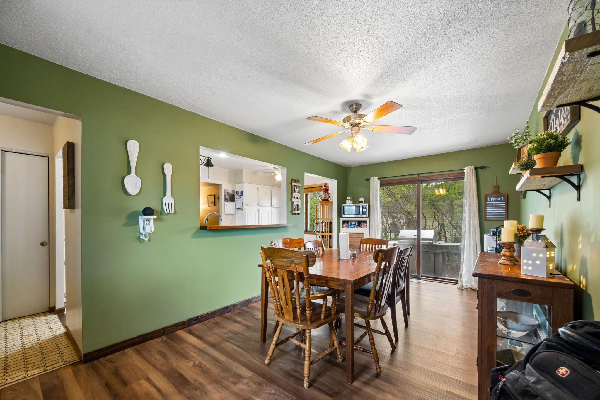 Dining Room Has Newer Wood Flooring With A Walkout To Side Patio & To Garage.. Perfect For Grilling & Entertaining