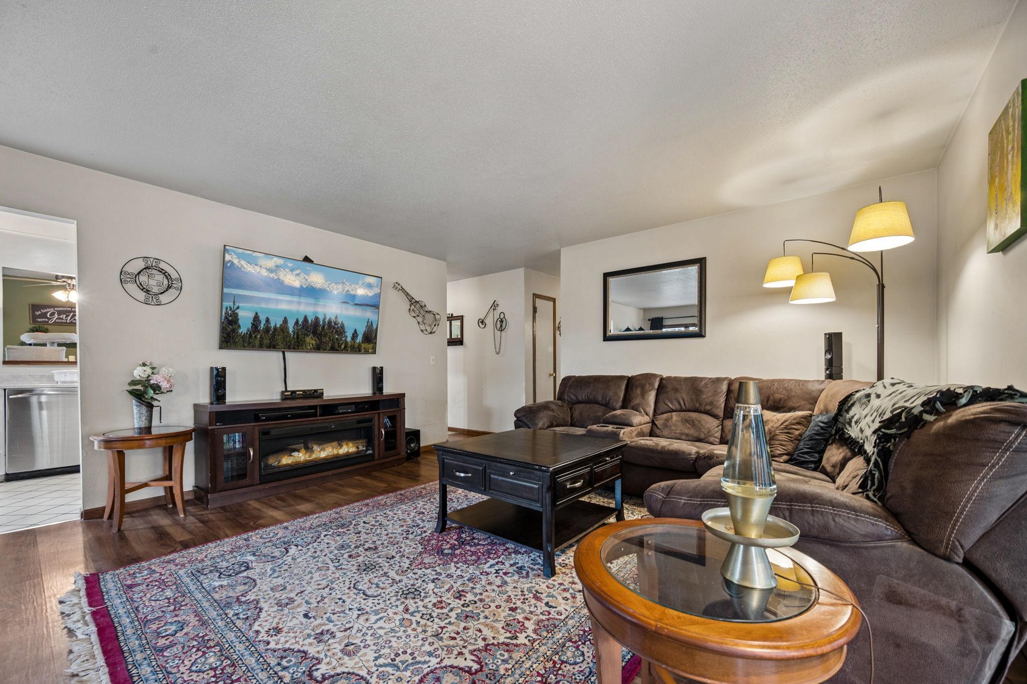 Living Room Has New Flooring Lots Of Natural Sunlight..