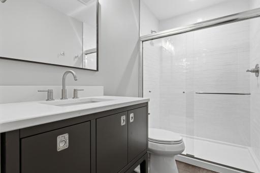 Beautiful walk-in shower with floor to ceiling tile