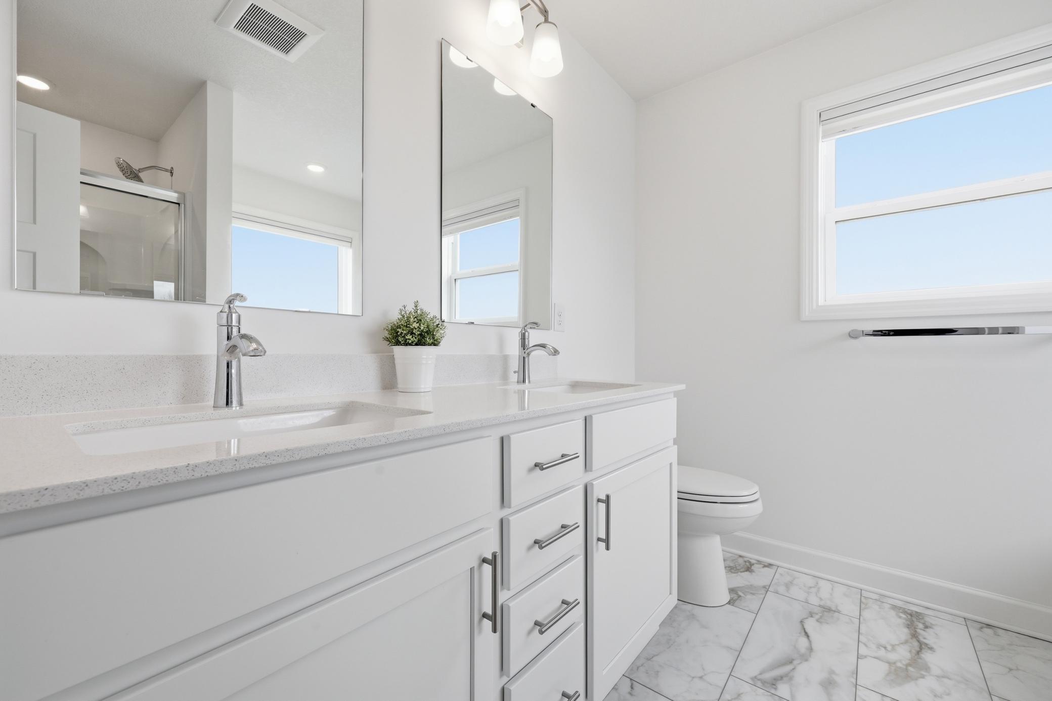 Light and bright ensuite bathroom with soaking tub and shower