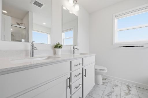 Light and bright ensuite bathroom with soaking tub and shower