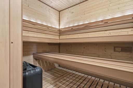 New, custom 7x8 sauna with dimmable light and programmable color changing light features in the backrest.