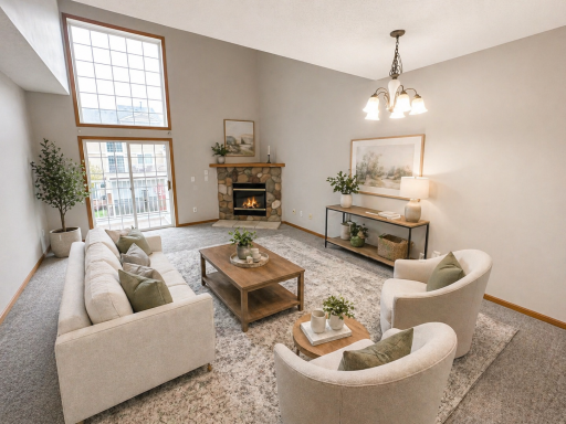 Large living room with gas fireplace and large windows
