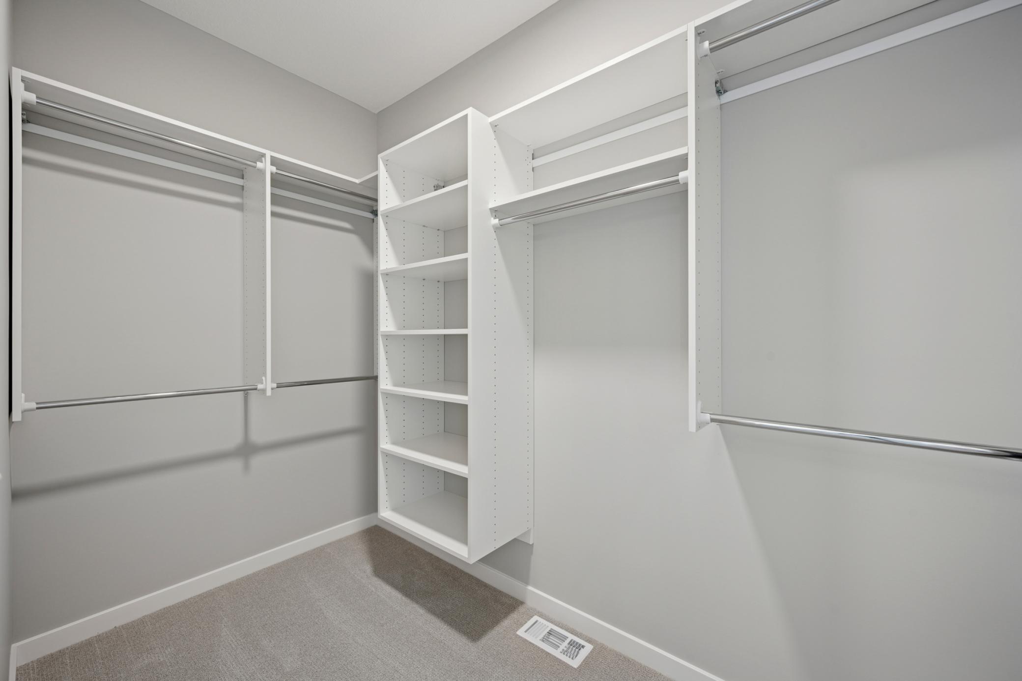 Primary Bedroom closet with upgraded shelving