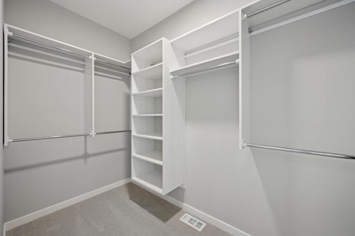 Primary Bedroom closet with upgraded shelving