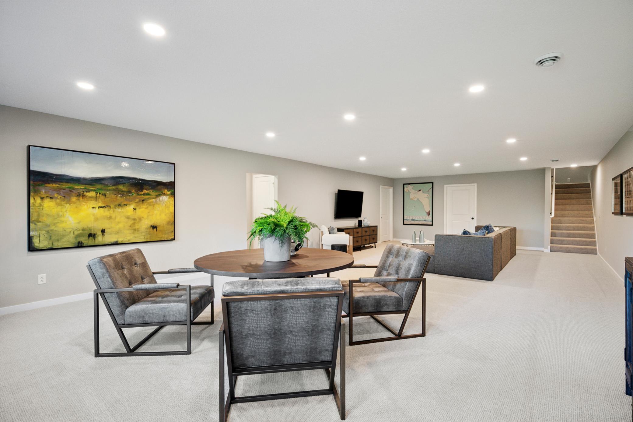 Spacious sun-filled finished Lower level with large mechanical room and additional large storage room! And 4th bedroom and another bathroom!