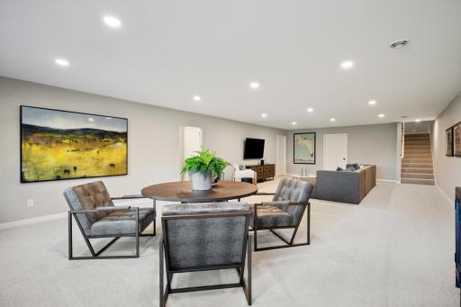 Spacious sun-filled finished Lower level with large mechanical room and additional large storage room! And 4th bedroom and another bathroom!