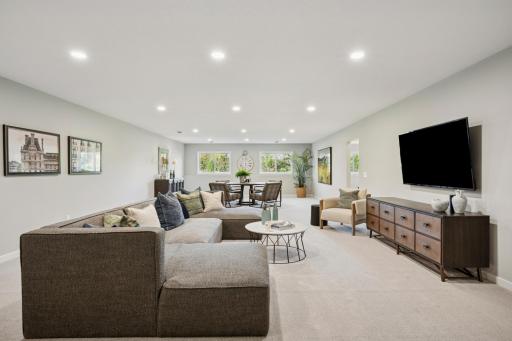 Spacious sun-filled finished Lower level with large mechanical room and additional large storage room! And 4th bedroom and another bathroom!