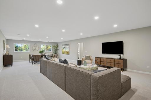 Spacious sun-filled finished Lower level with large mechanical room and additional large storage room! And 4th bedroom and another bathroom!