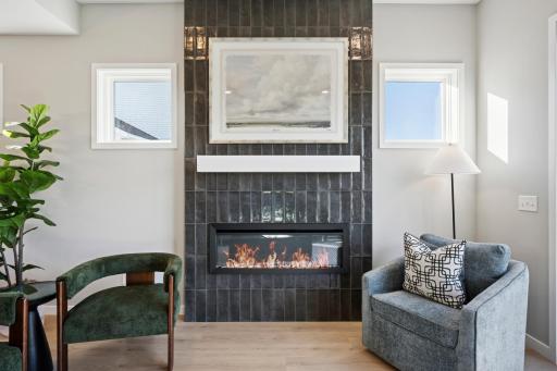 Gathering room features Tiled floor-to-ceiling fireplace!
