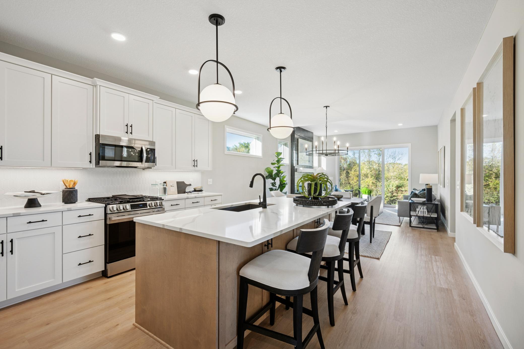 Over-sized Island, quality cabinets, walk-in pantry, & beautiful quartz countertops!