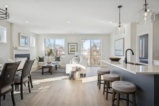 Sun-filled new Home with warranties, amazing views backing to wetlands!! 2 bedrooms on main floor, + flex room, and another bedroom at sunny finished lower level + storage room! And Spacious 3-car garage you will love!