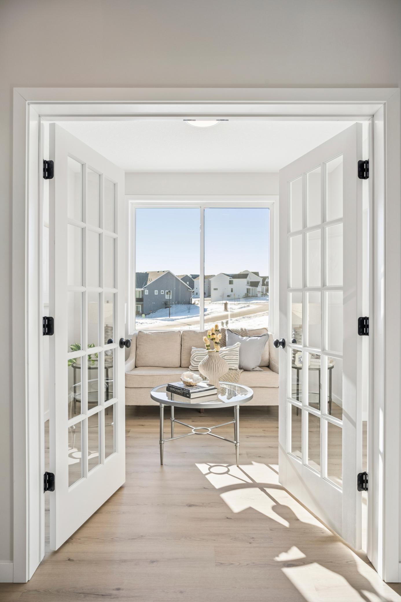 Den, office, or sitting room with French doors, and pocket office....