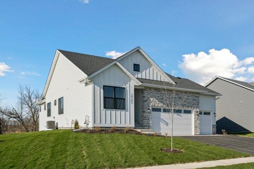 RW03002001 – Kendall A – 14703 Kingsview Lane North, Front exterior siding features L.P. Smart-side! And Oversized 3-car Garage!