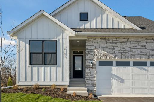 RW03002001 – Kendall A – 14703 Kingsview Lane North , Front exterior siding features L.P. Smartside! And Oversized 3-car Garage! Many extras included in this home! including Garage windows & both garage door openers!
