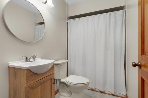 Freshly updated lower-level bathroom with modern finishes.