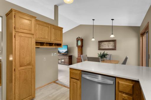 The kitchen flows seamlessly into the informal dining and living areas.