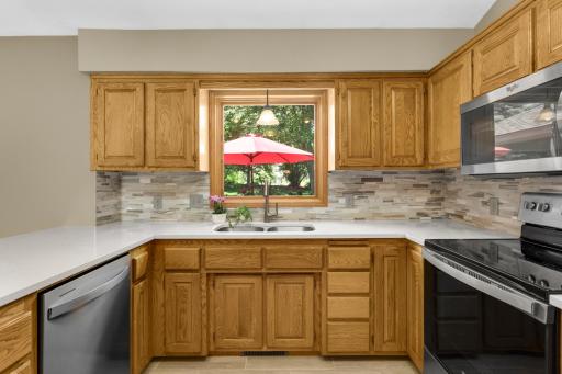 A picture window overlooks the beautiful custom deck.