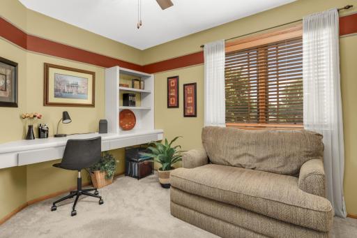 Fourth upper level bed/home office with custom built in desk & storage.