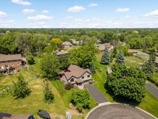 Perfectly tucked into this wooded .27 acre lot.