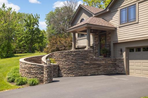 Custom craftsmanship begins with this stunning stone stairway.