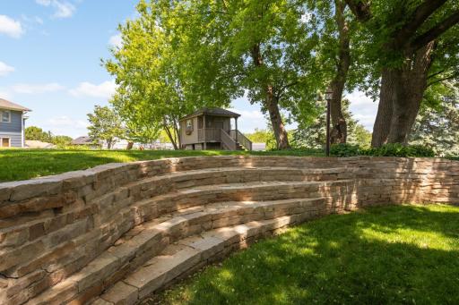 Designed and built by the owner, this fieldstone retaining wall is a highlight of the backyard.