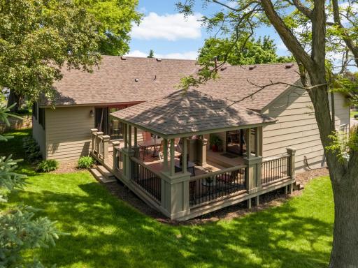 A custom designed pergola provides shade and charm to this backyard feature.