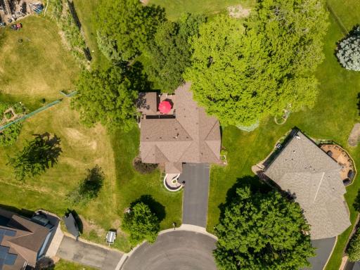 Situated at the end of the cul-de-sac on wooded lot for tranquil living.