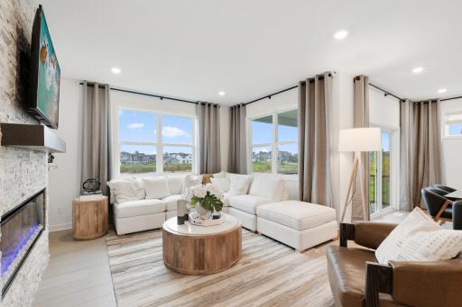ShawÂ® luxury plank flooring runs throughout the Great Room, kitchen and dining room to create a cohesive look