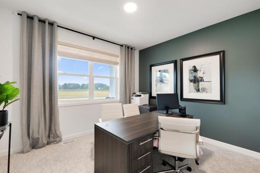 Both secondary bedrooms include a practical closet and premium wall-to-wall carpeting for plush comfort. Furnished here as a home office for those remote days.