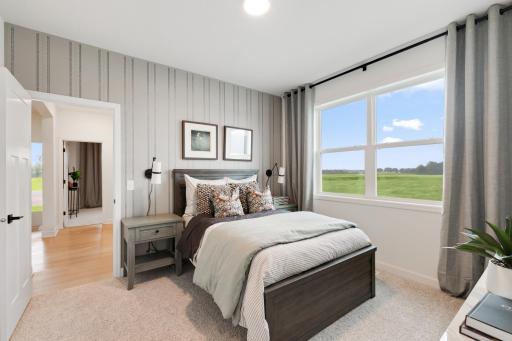 Two secondary bedrooms provide excellent sleeping accommodations for family members or overnight guests.