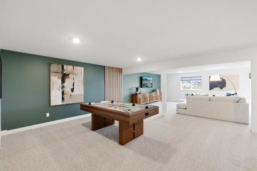 The game room boasts an expansive footprint, perfect for creating the ultimate entertainment space