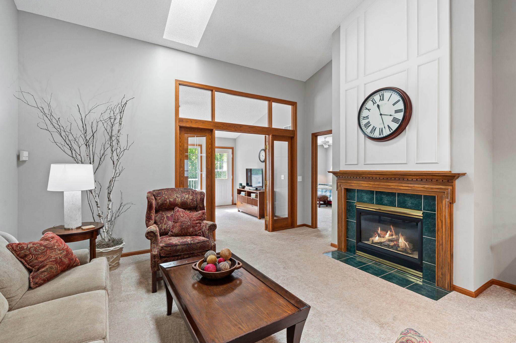 A gas fireplace is the perfect cozy convenience on chilly days. We have a view into the sunroom/sitting/TV room here.
