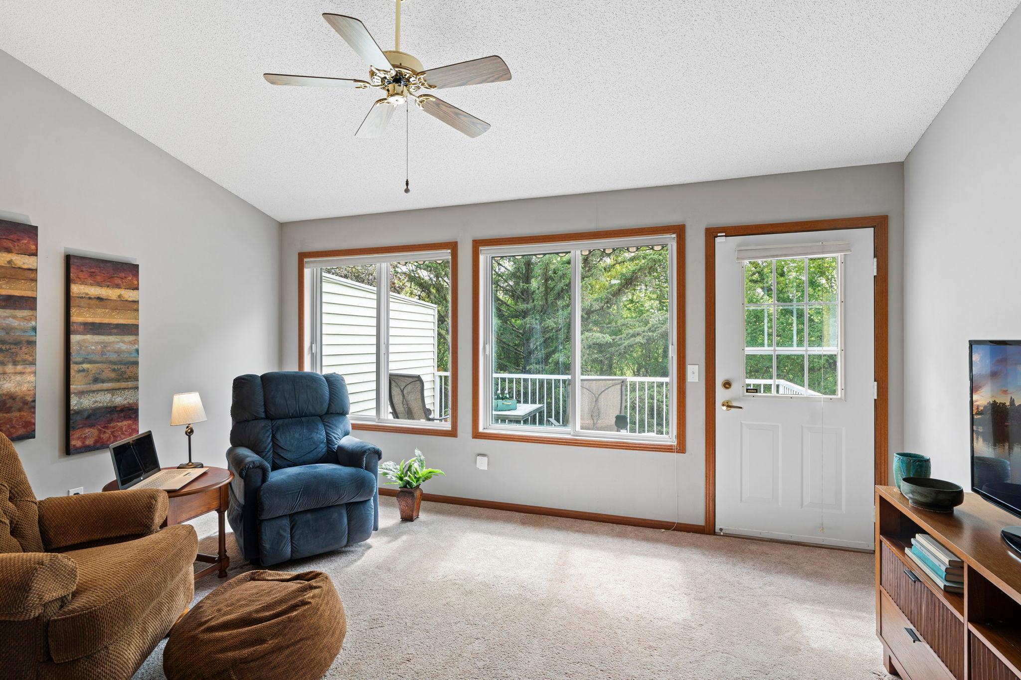 The vaulted sitting room is spacious and bright, perfect for TV watching, reading, crafts (all that light), a music room or a home office.