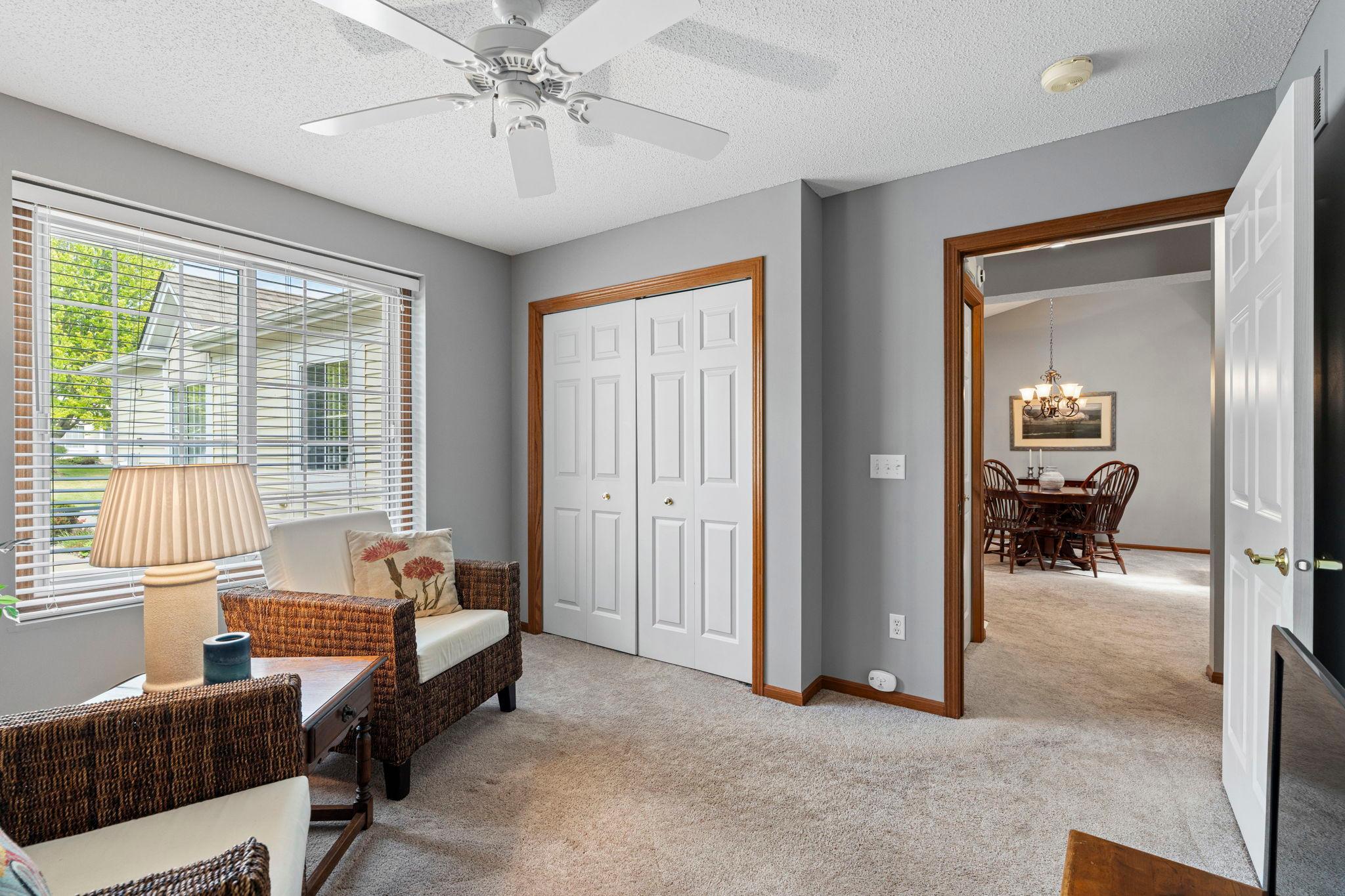 Second bedroom has large windows and lovely white paneled doors. Currently used as TV room, could also be an office.