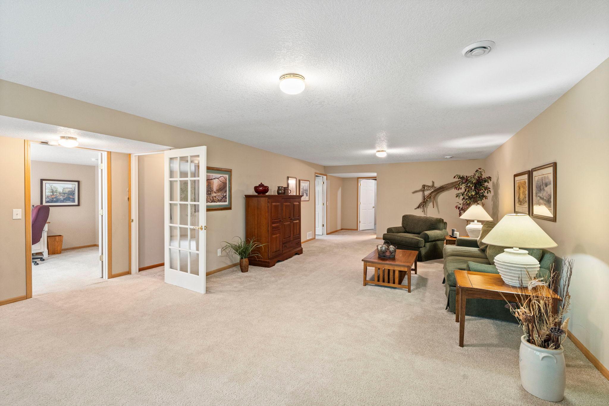 Huge lower level family room offers more space for entertaining, TV watching, a teen hangout, hobbies and more.