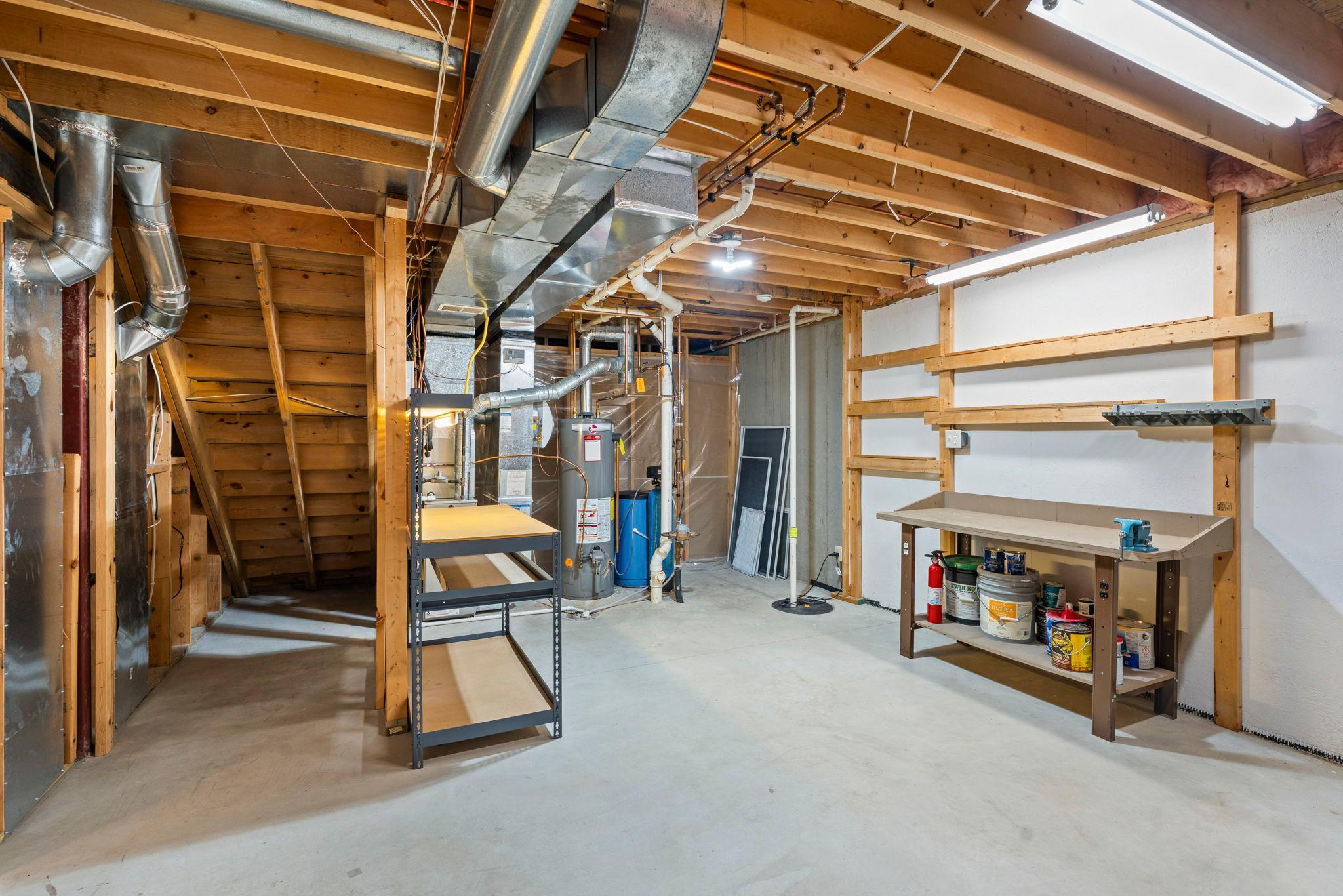 Utility area has storage space and room for a workshop. Home is wired for security but owners do not use it. Water softener is not working. The owners found they did not need it.