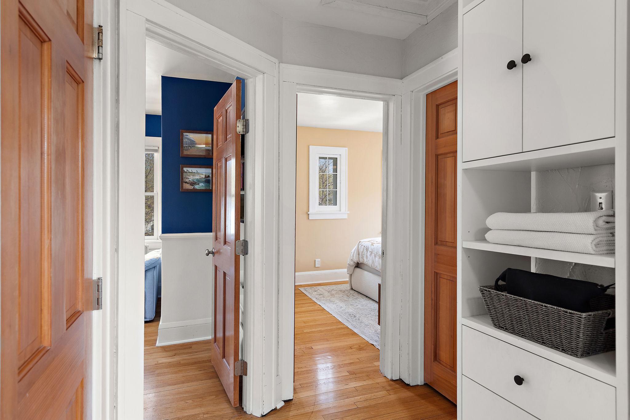 Upper hallway leading to three bedrooms on the upper level