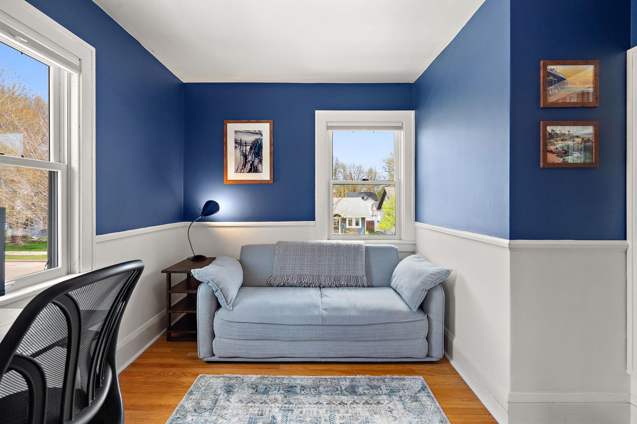 Three windows and a built-in bookshelf in bedroom 2