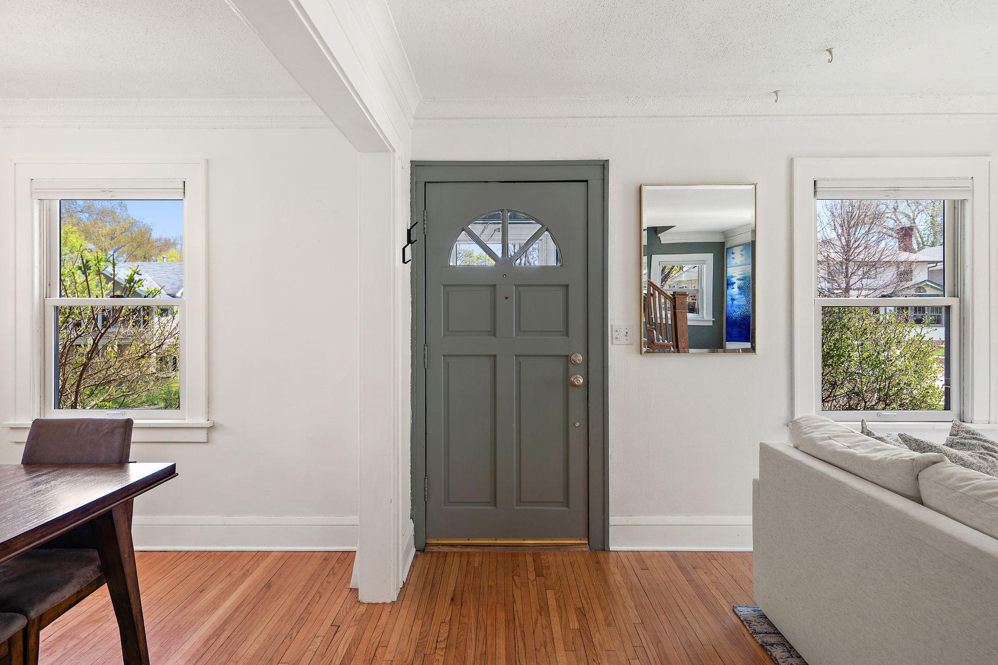 Original hardwood floors and coved ceilings throughout