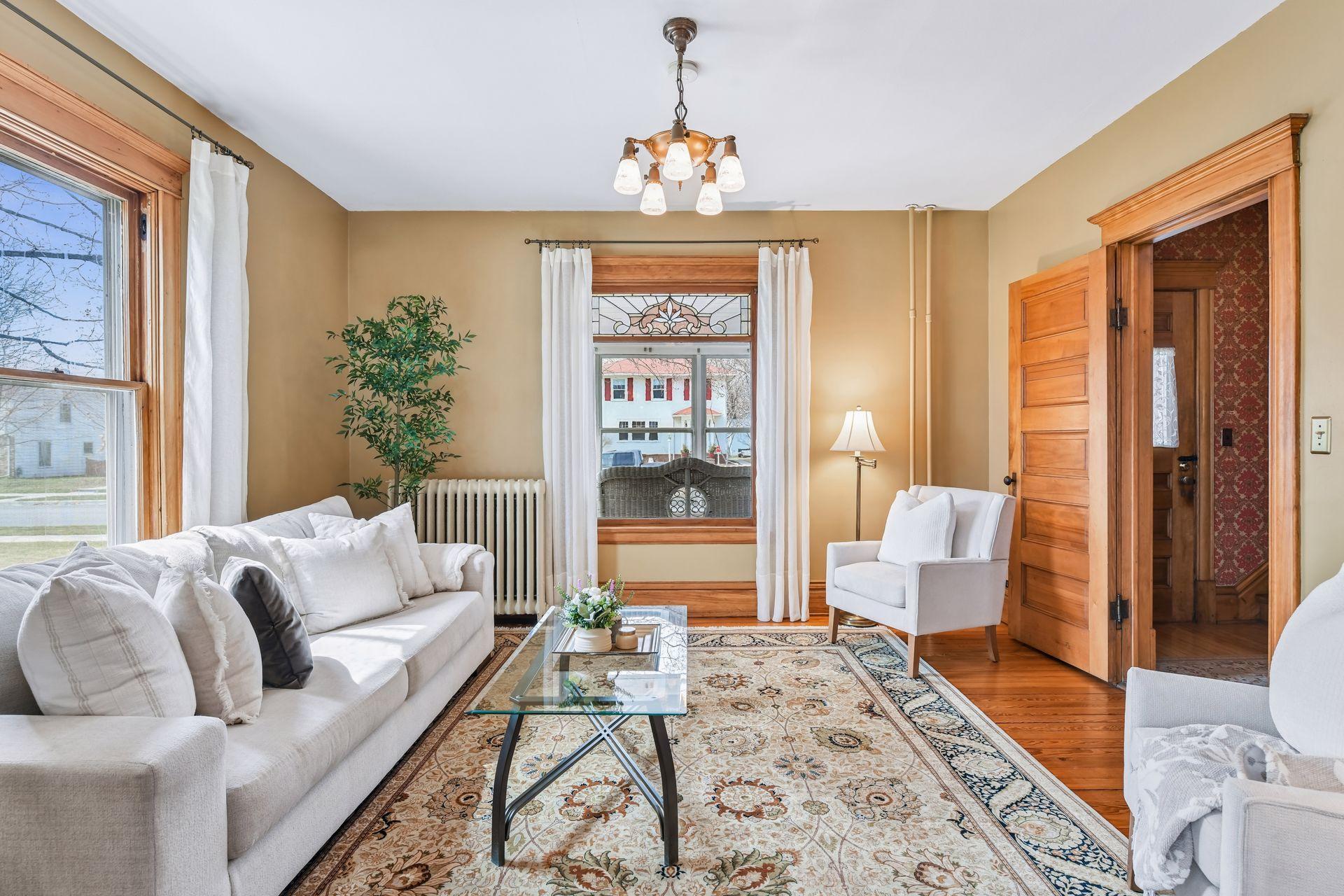 Timeless details include stained glass, five-panel doors, and rich Craftsman window casings, trim, and mop boards.