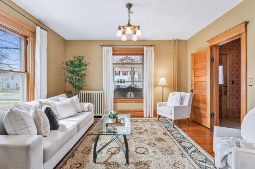 Timeless details include stained glass, five-panel doors, and rich Craftsman window casings, trim, and mop boards.