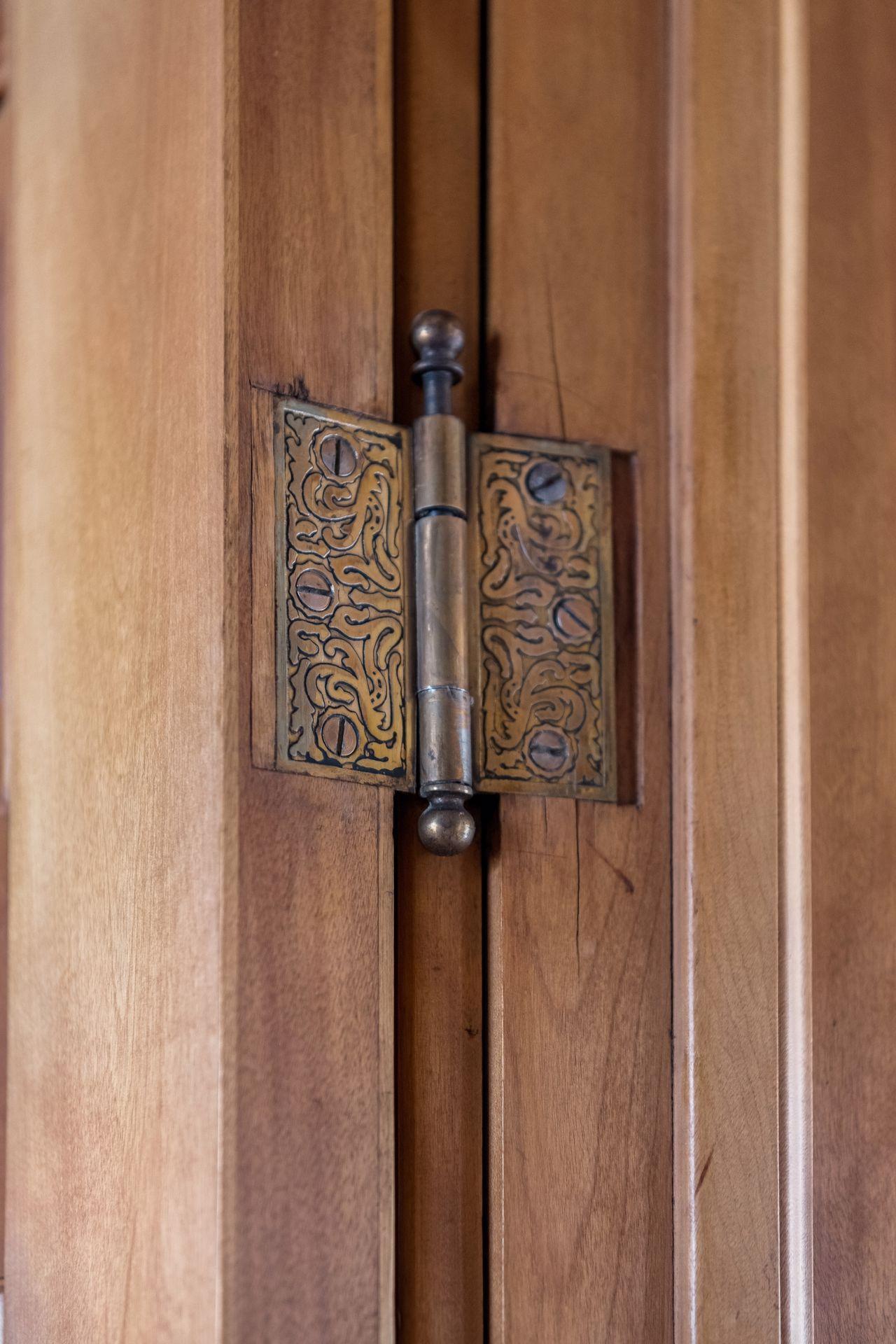 Gorgeous original iron art on the hinges