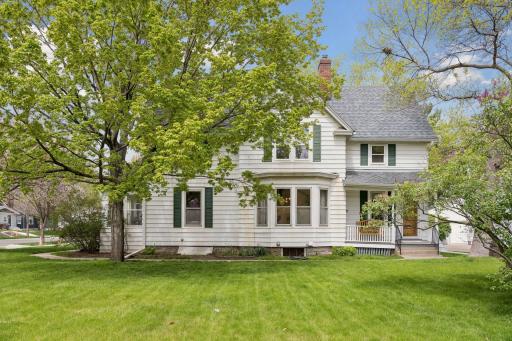 Victorian architecture shines through with the decorative gabled roofline, bay window, and charming porches
