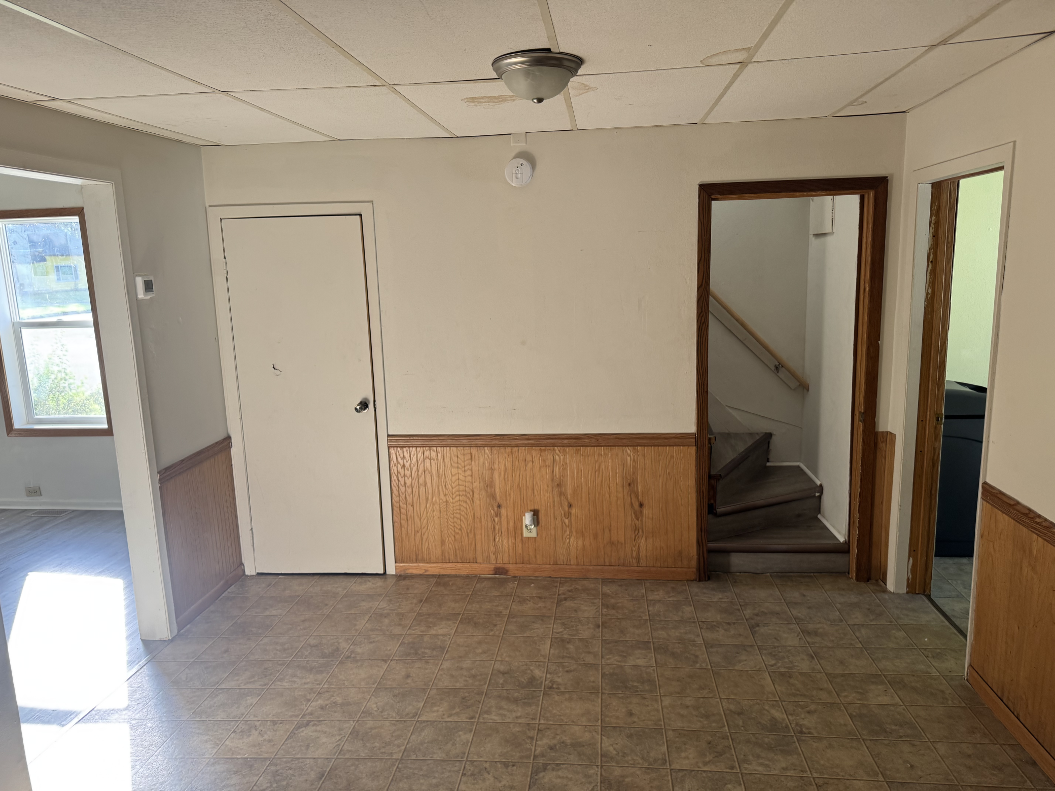 From the kitchen, looking to the stairs to second level