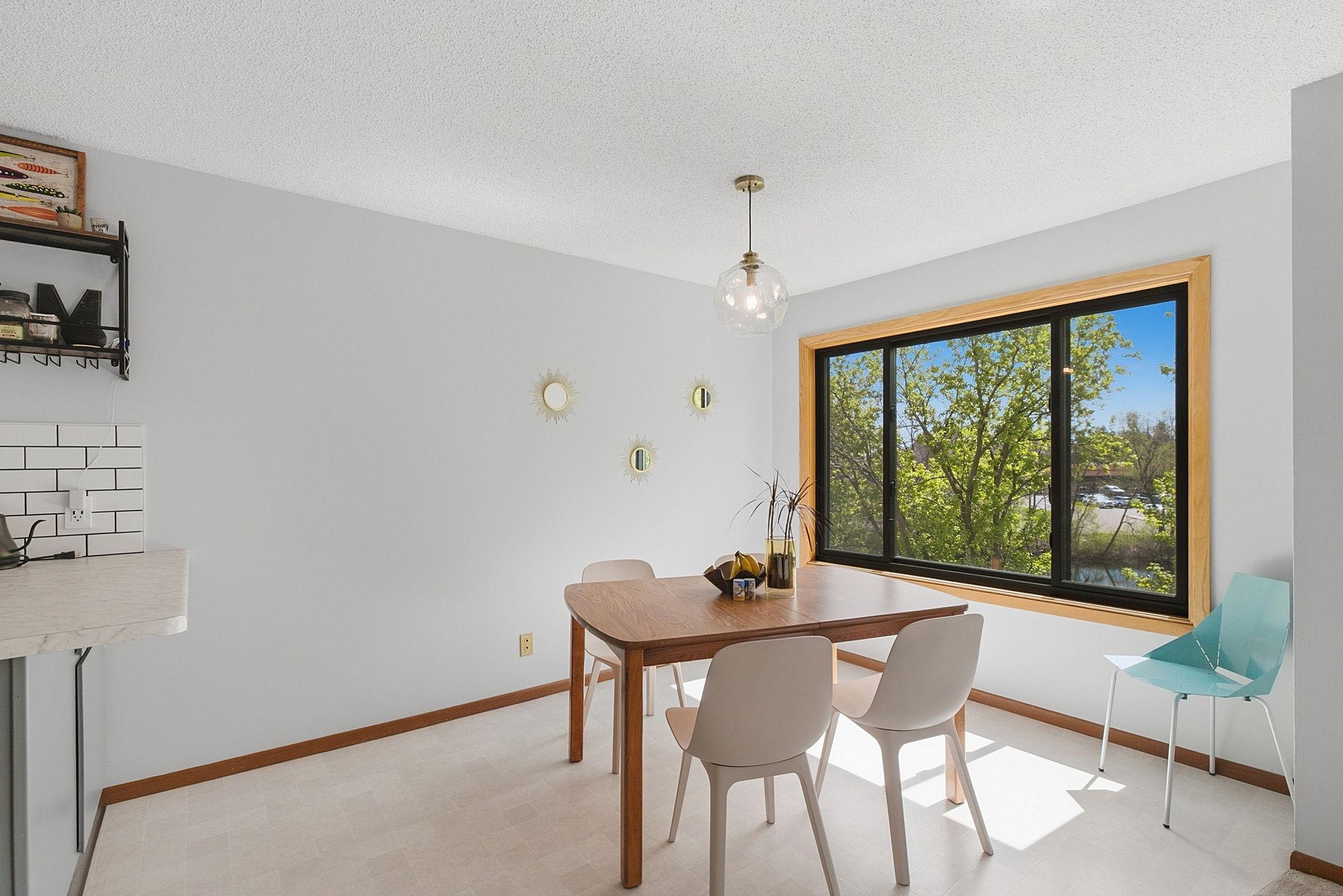 Dining area with large window for lots of natural light.