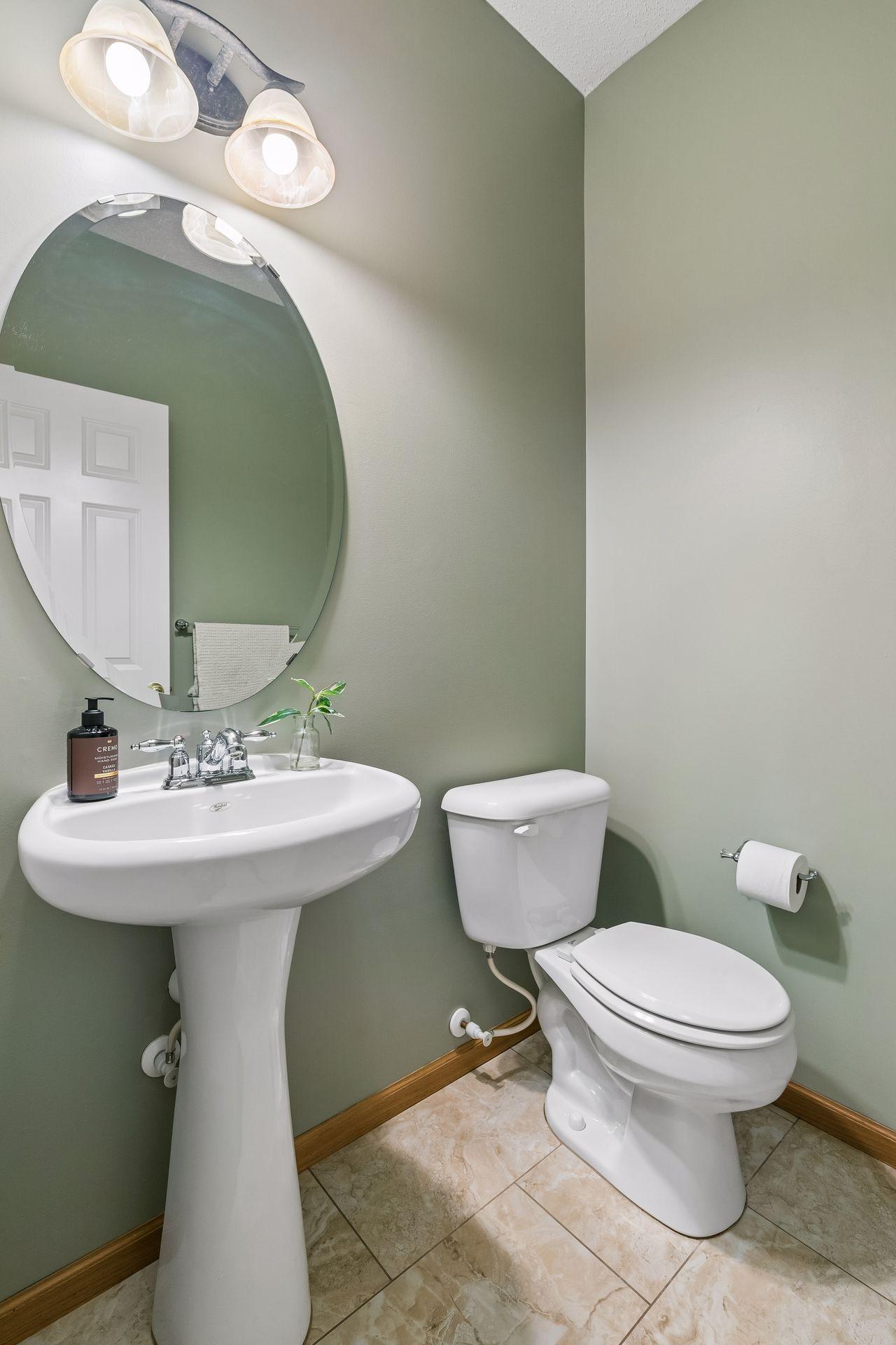 Half bath located just off the living room and kitchen area.