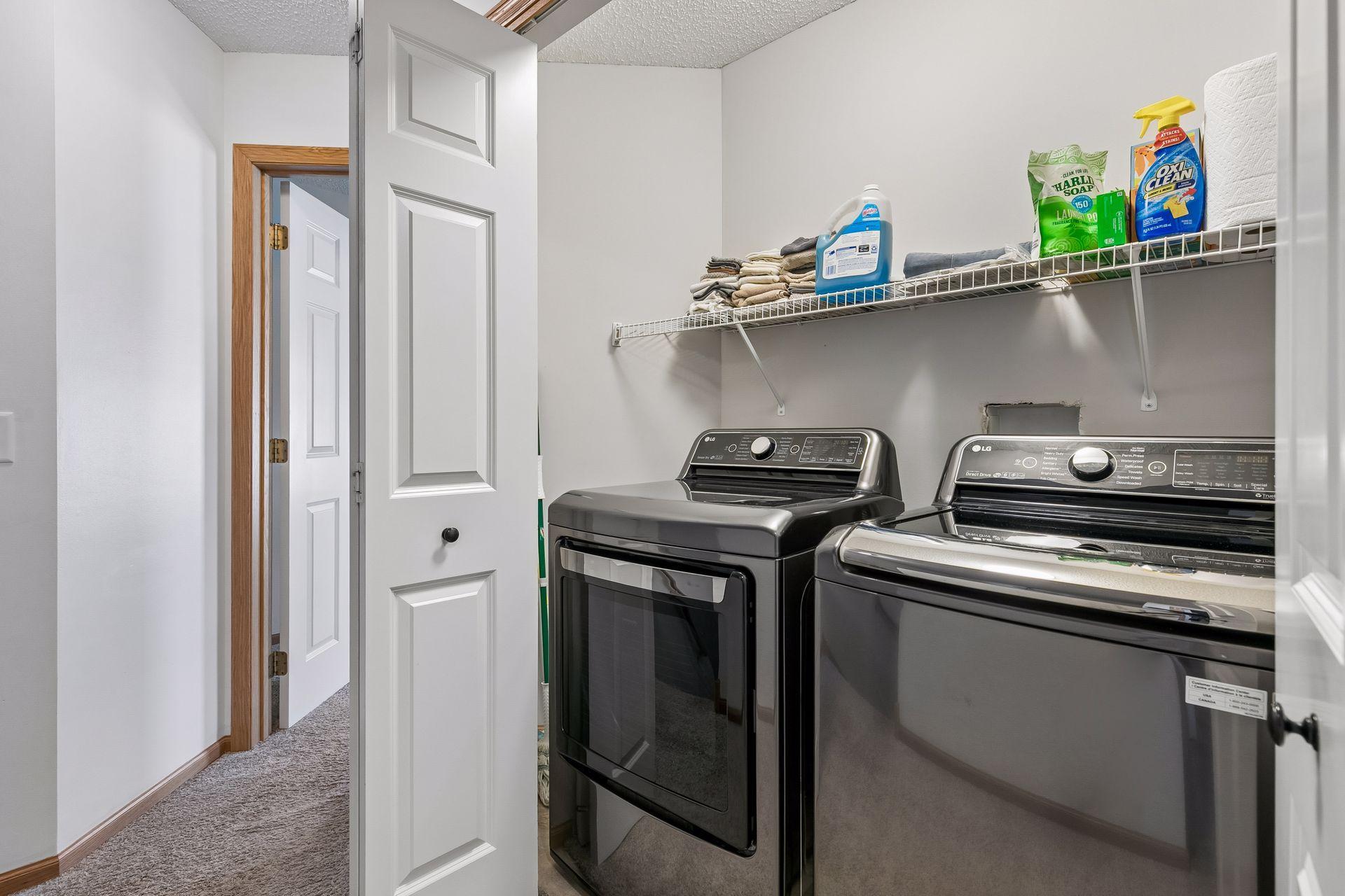 The laundry closet is conveniently located between the two upper level bedrooms.