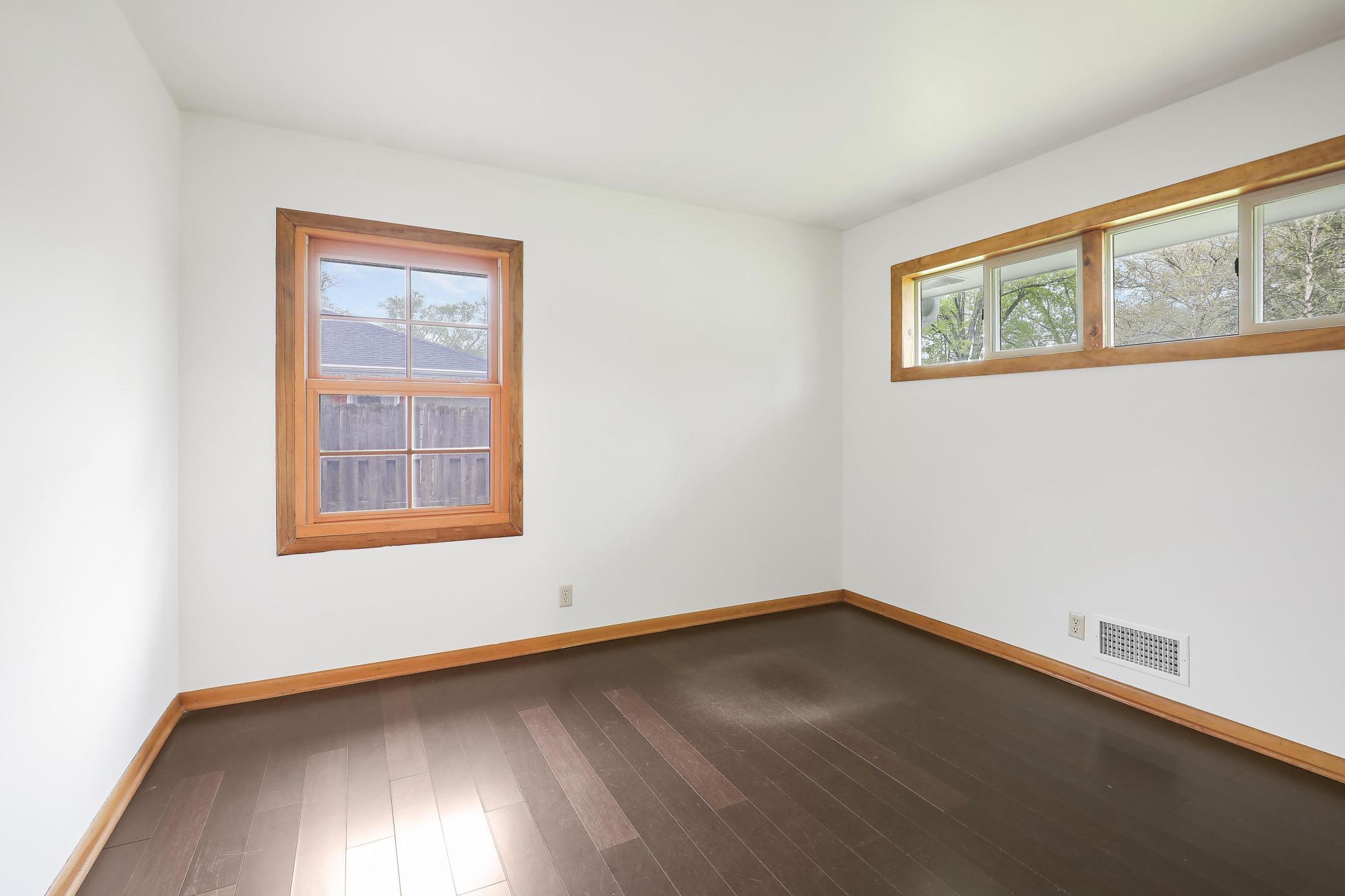 Second main level bedroom with private East facing windows.