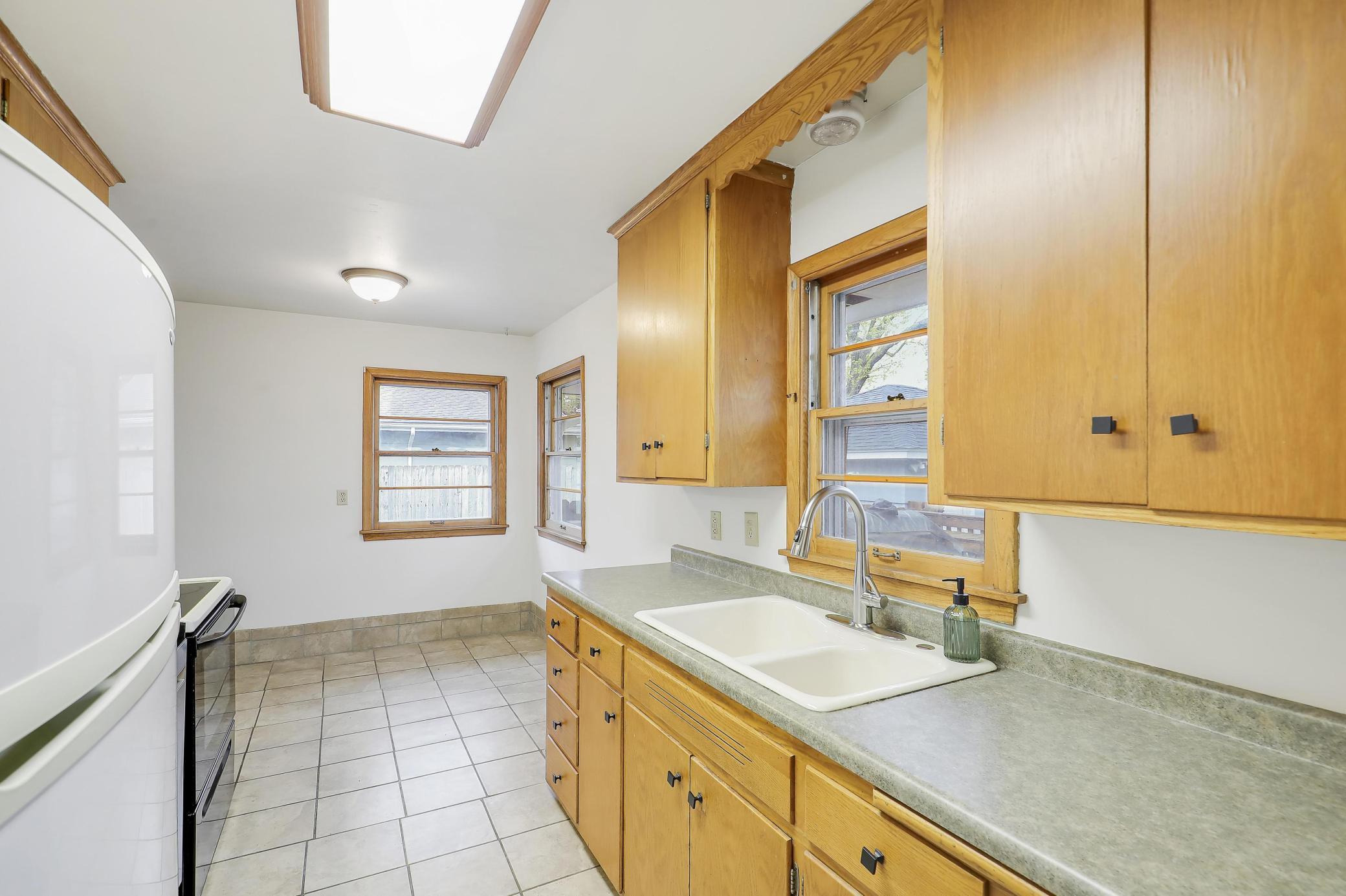 Get a great view of the backyard out your west facing kitchen window.